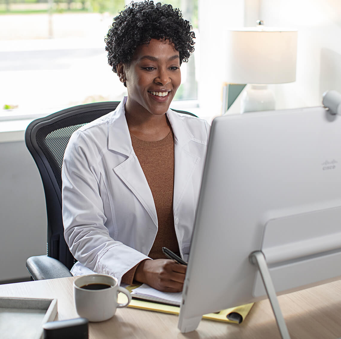 Woman sitting at a computer working
