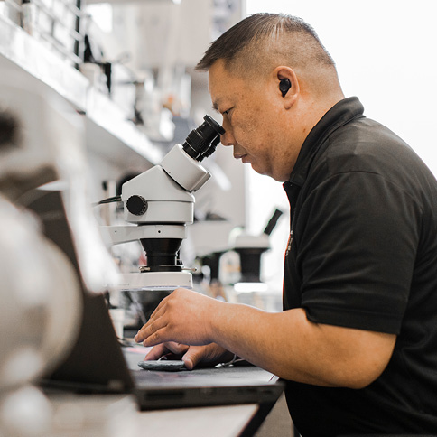 Man using a microscope