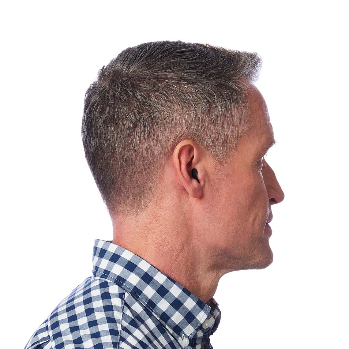 A CIC hearing aid shown in a man's ear